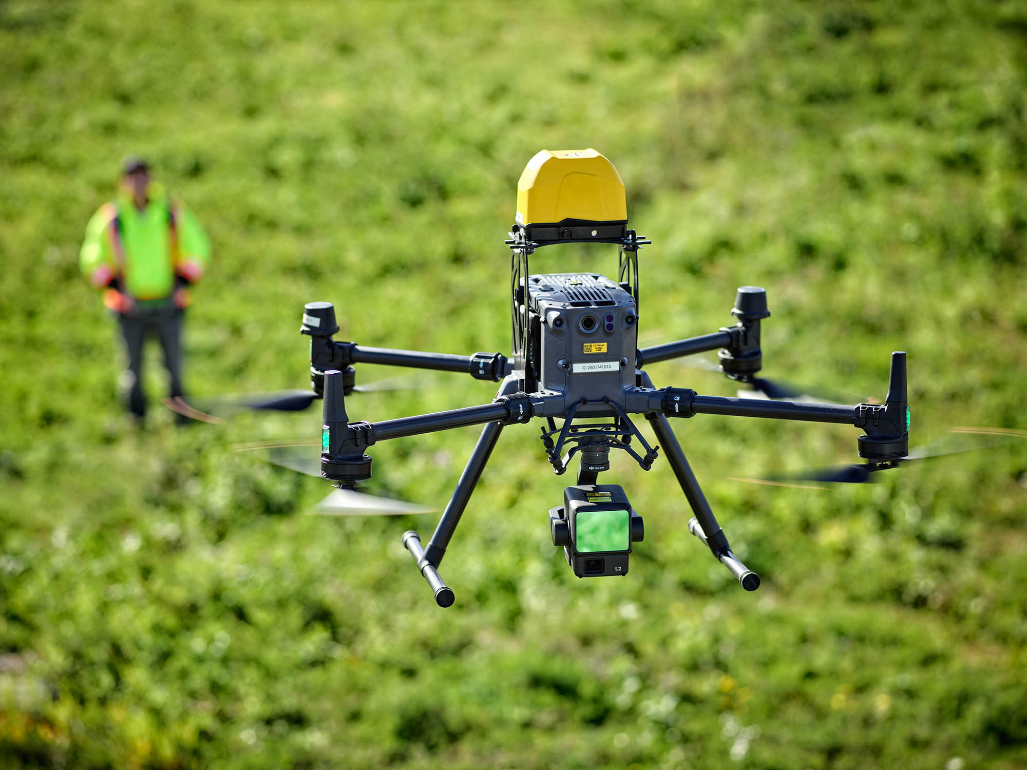 Close up of a drone with pilot in the distance