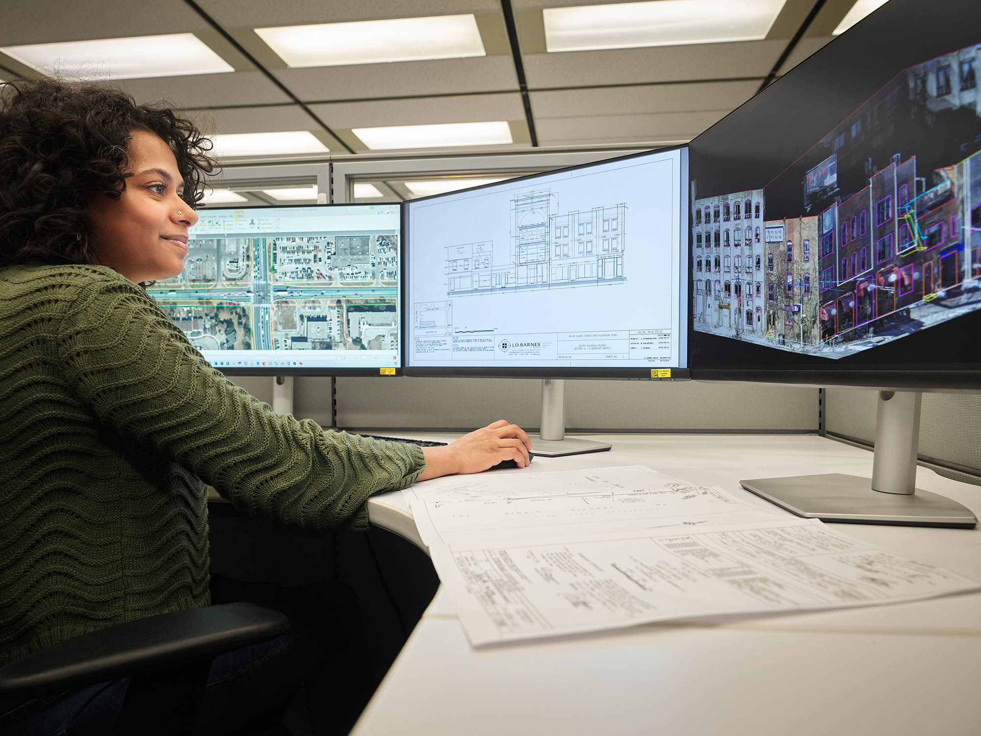 J.D. Barnes technician viewing three monitors